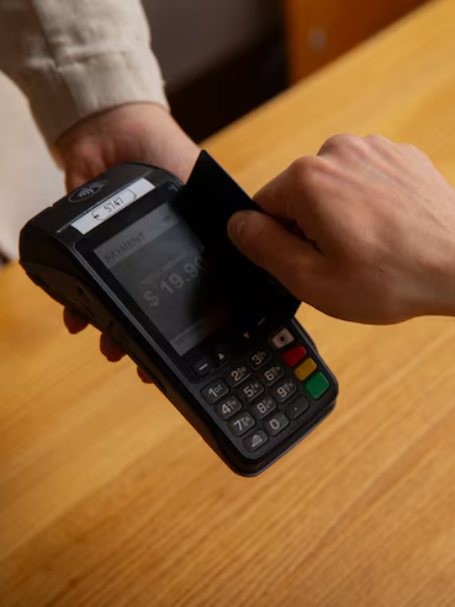 cropped-high-angle-customer-paying-with-nfc-device_23-2150690015.png